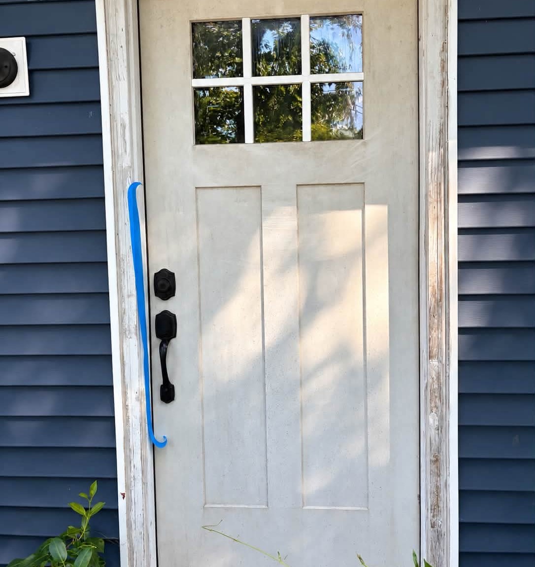 Before: weathered, dirty front door and trim